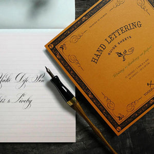 Tools to Liveby Calligraphy Practice Notebook (Orange - Handwriting)